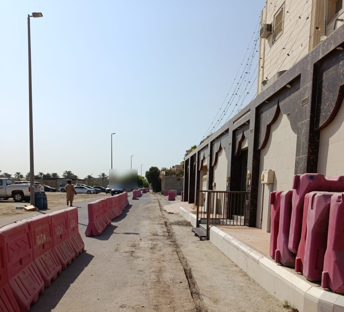 Street section with works barriers on a fibre route — programme delivery environment